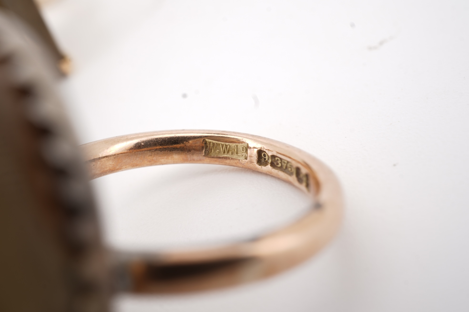 A modern 9ct gold and single stone emerald cut smoky quartz set ring, size N and one other 1960's 9ct gold shank, with a later added agate set white metal mount.